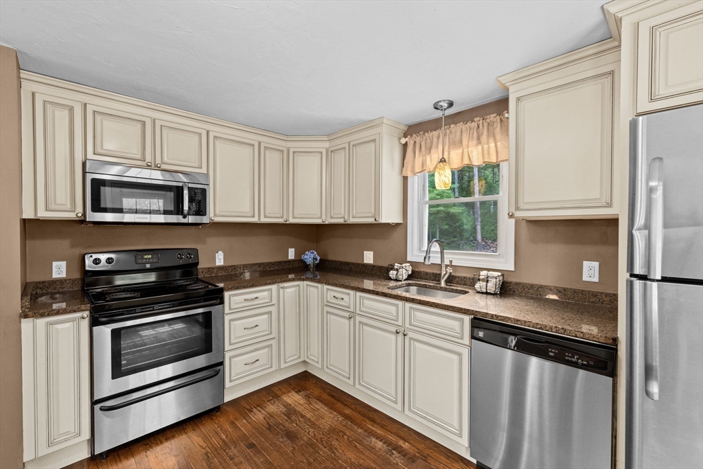 74 Rochester Road Carver, MA 02330 - Photo 5 of 31 a kitchen with a sink stove top oven and microwave