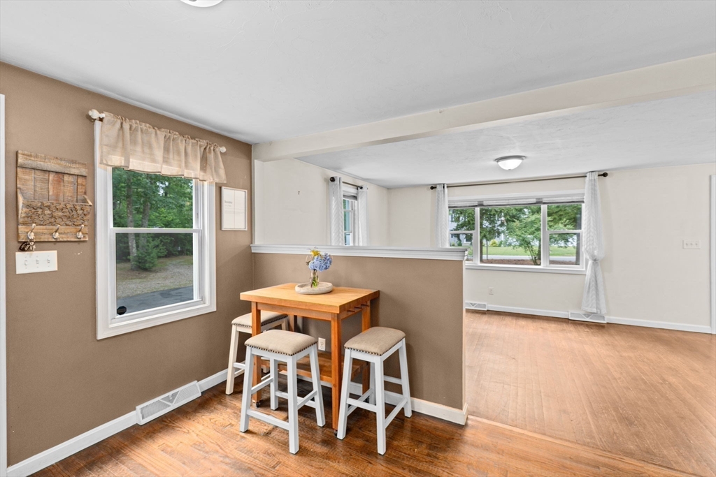 74 Rochester Road Carver, MA 02330 - Photo 7 of 31 a dining room with furniture window wooden floor
