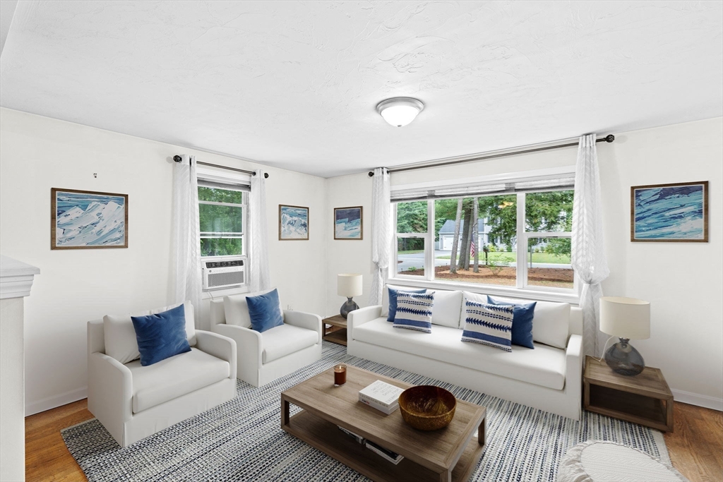 74 Rochester Road Carver, MA 02330 - Photo 9 of 31 a living room with furniture and a large window