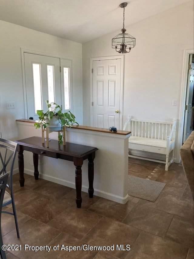 1394 Firethorn Drive Rifle, CO 81650 - Photo 18 of 43 a living room with furniture and a table