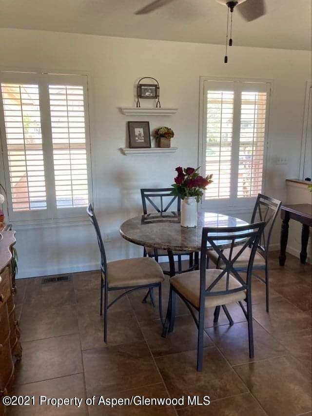 1394 Firethorn Drive Rifle, CO 81650 - Photo 19 of 43 a view of a dining room with furniture and window
