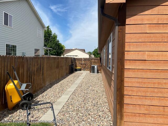 1394 Firethorn Drive Rifle, CO 81650 - Photo 24 of 43 a view of balcony with wooden floor and outdoor seating