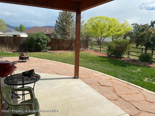 1394 Firethorn Drive Rifle, CO 81650 - Photo 29 of 43 a view of backyard with seating area and green space