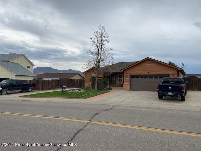 1394 Firethorn Drive Rifle, CO 81650 - Photo 3 of 43 a car parked in front of house