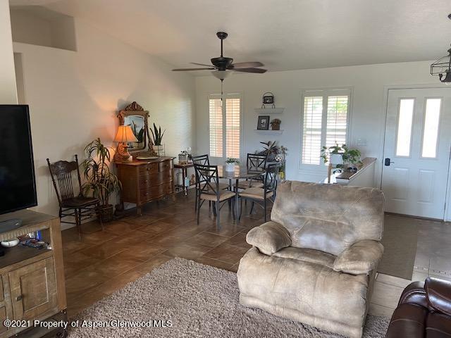 1394 Firethorn Drive Rifle, CO 81650 - Photo 39 of 43 a living room with furniture and a flat screen tv