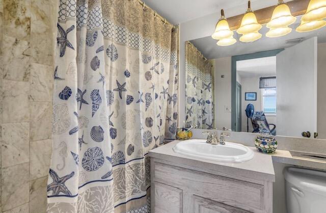 2000 Coco Plum Drive, Unit 603 Marathon, FL 33050 - Photo 12 of 22 a bathroom with a sink and a mirror