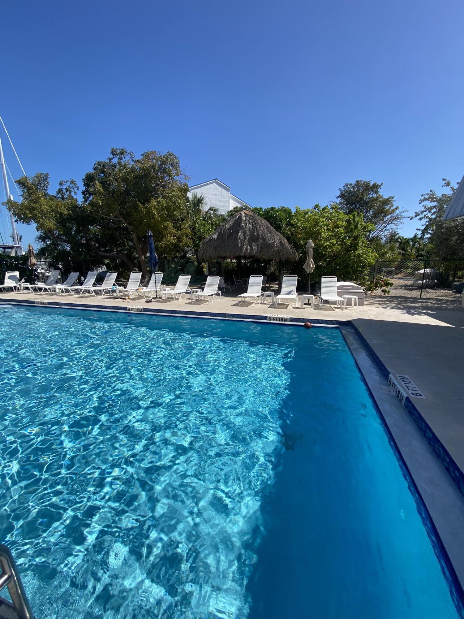 2000 Coco Plum Drive, Unit 603 Marathon, FL 33050 - Photo 17 of 22 a view of a television with a yard