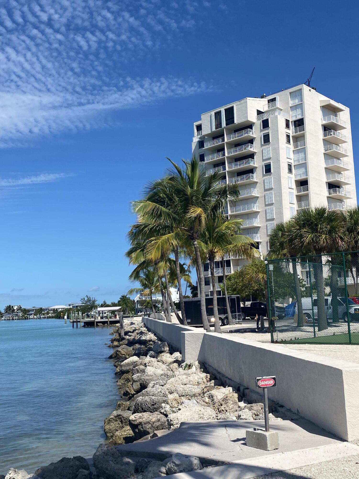 2000 Coco Plum Drive, Unit 603 Marathon, FL 33050 - Photo 18 of 22 a view of building with outdoor space