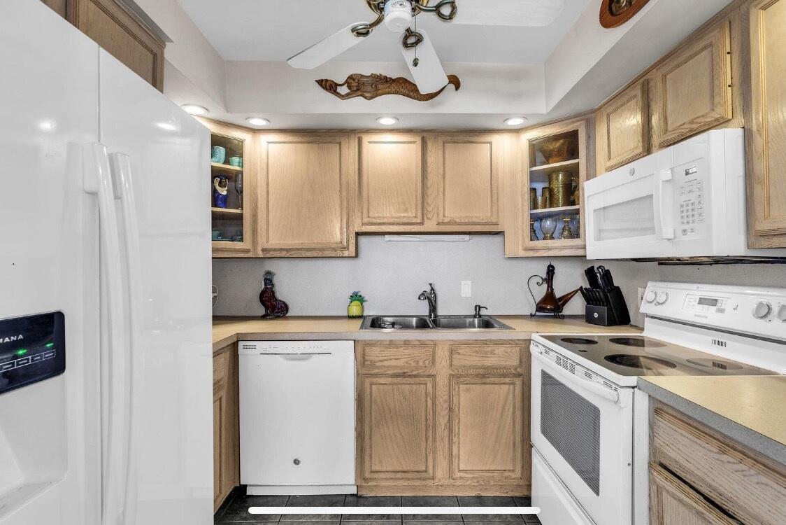 2000 Coco Plum Drive, Unit 603 Marathon, FL 33050 - Photo 8 of 22 a kitchen with stainless steel appliances granite countertop a sink and cabinets