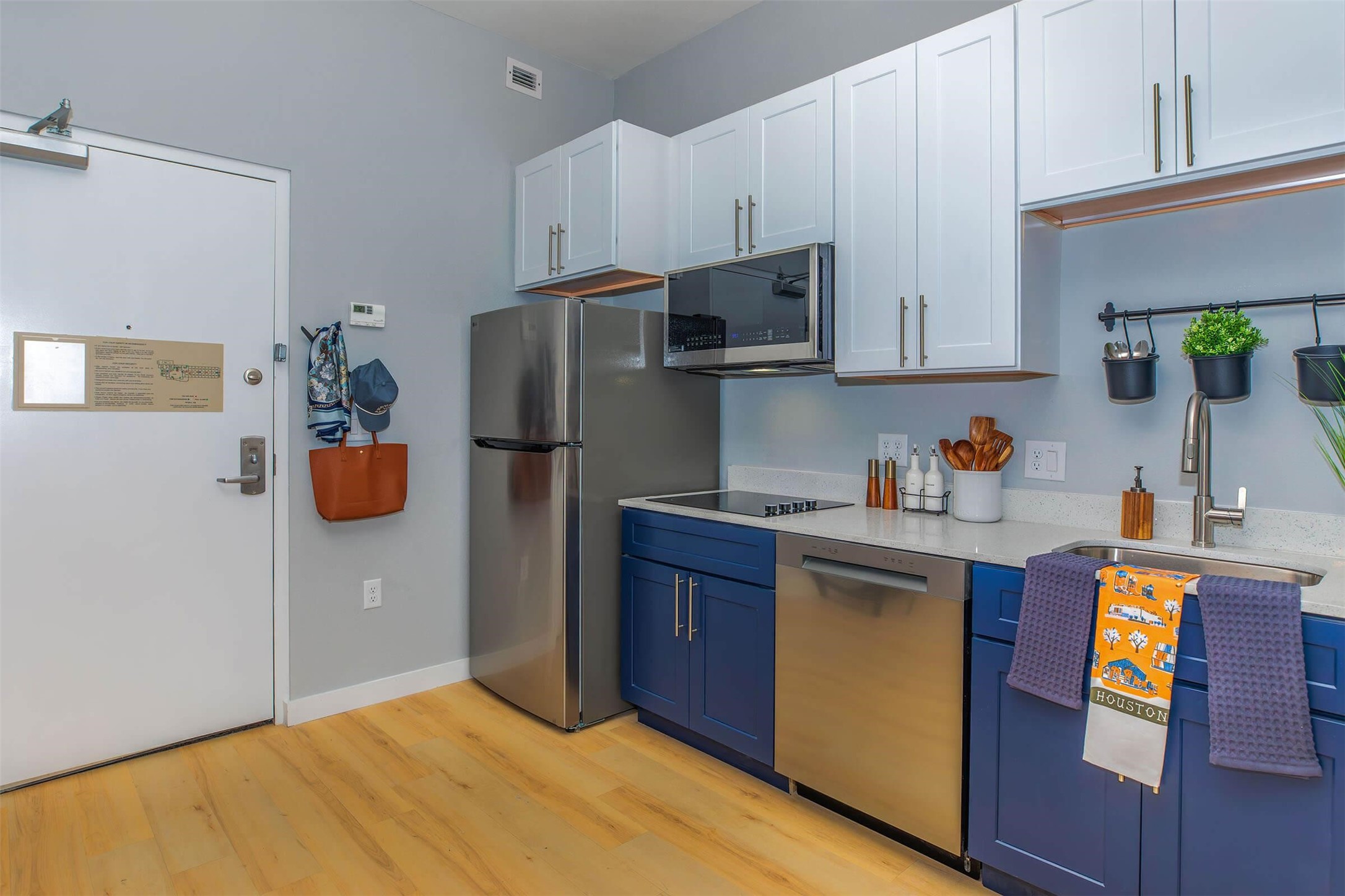 1350 Broadfield Boulevard, Unit 321 Houston, TX 77084 - Photo 5 of 29 a kitchen with stainless steel appliances granite countertop a refrigerator sink and stove