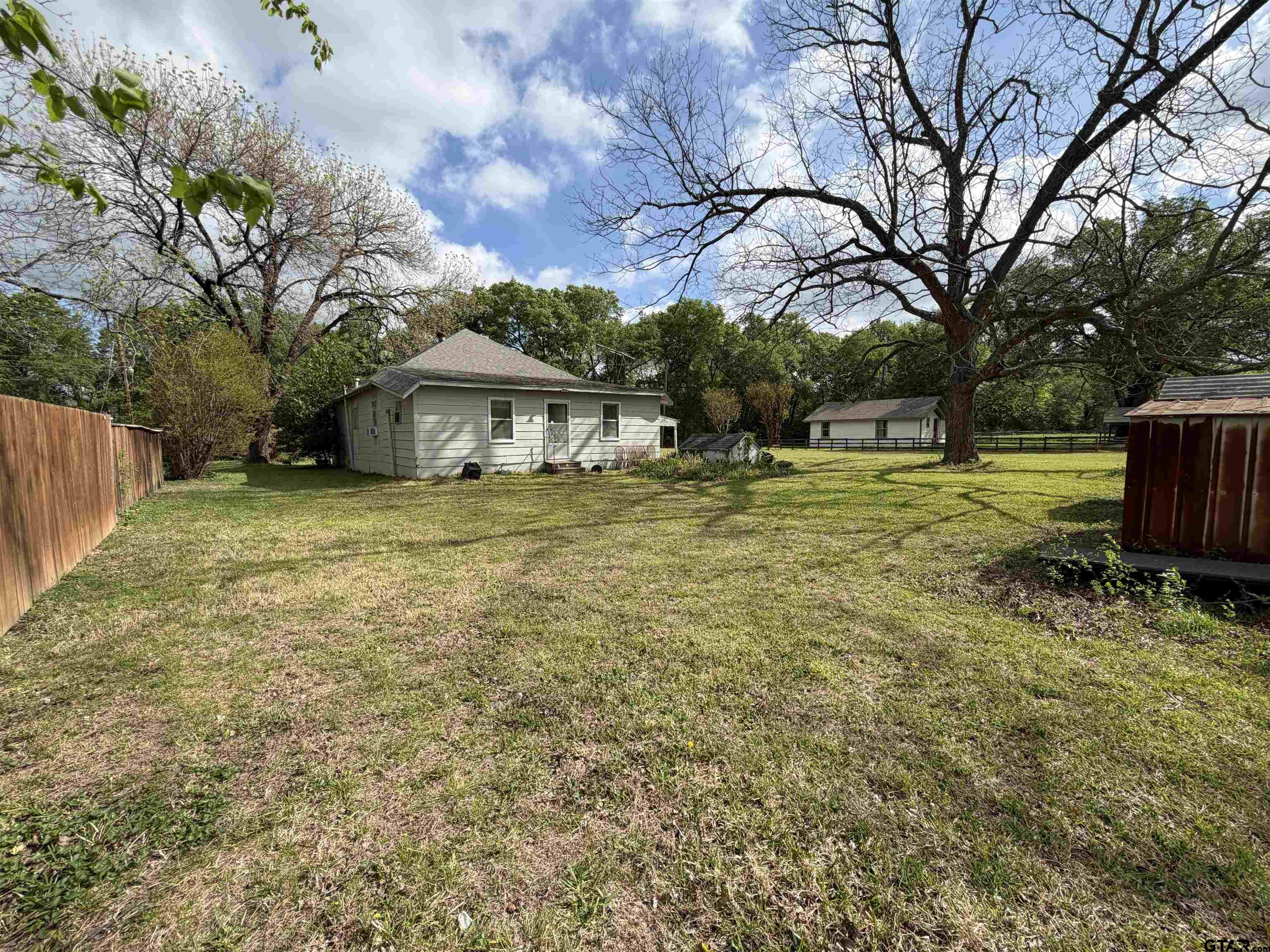 609 Walnut Mineola, TX 75773 - Photo 20 of 23 a view of a house with a yard