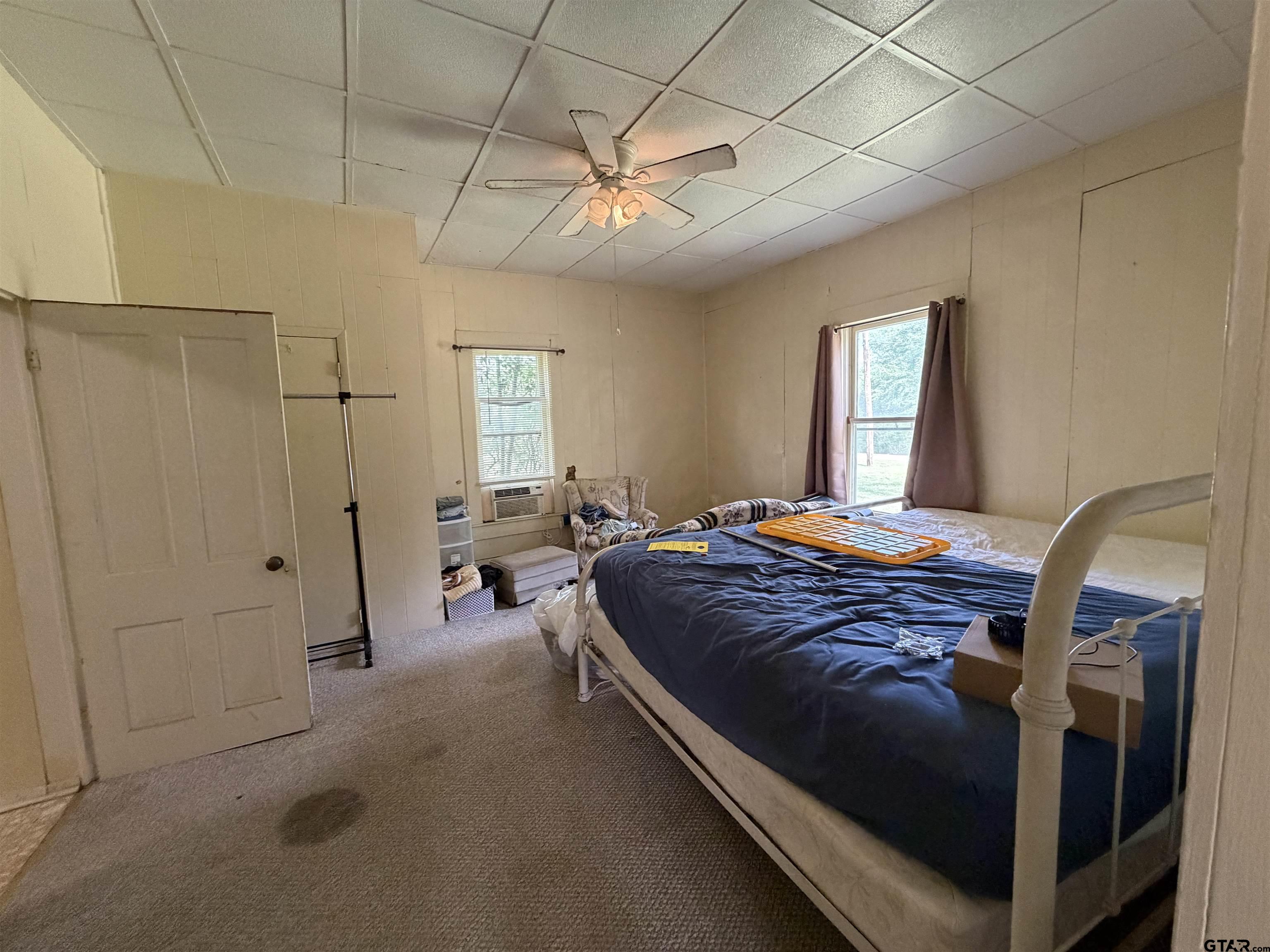 609 Walnut Mineola, TX 75773 - Photo 6 of 23 a bedroom with a bed and window