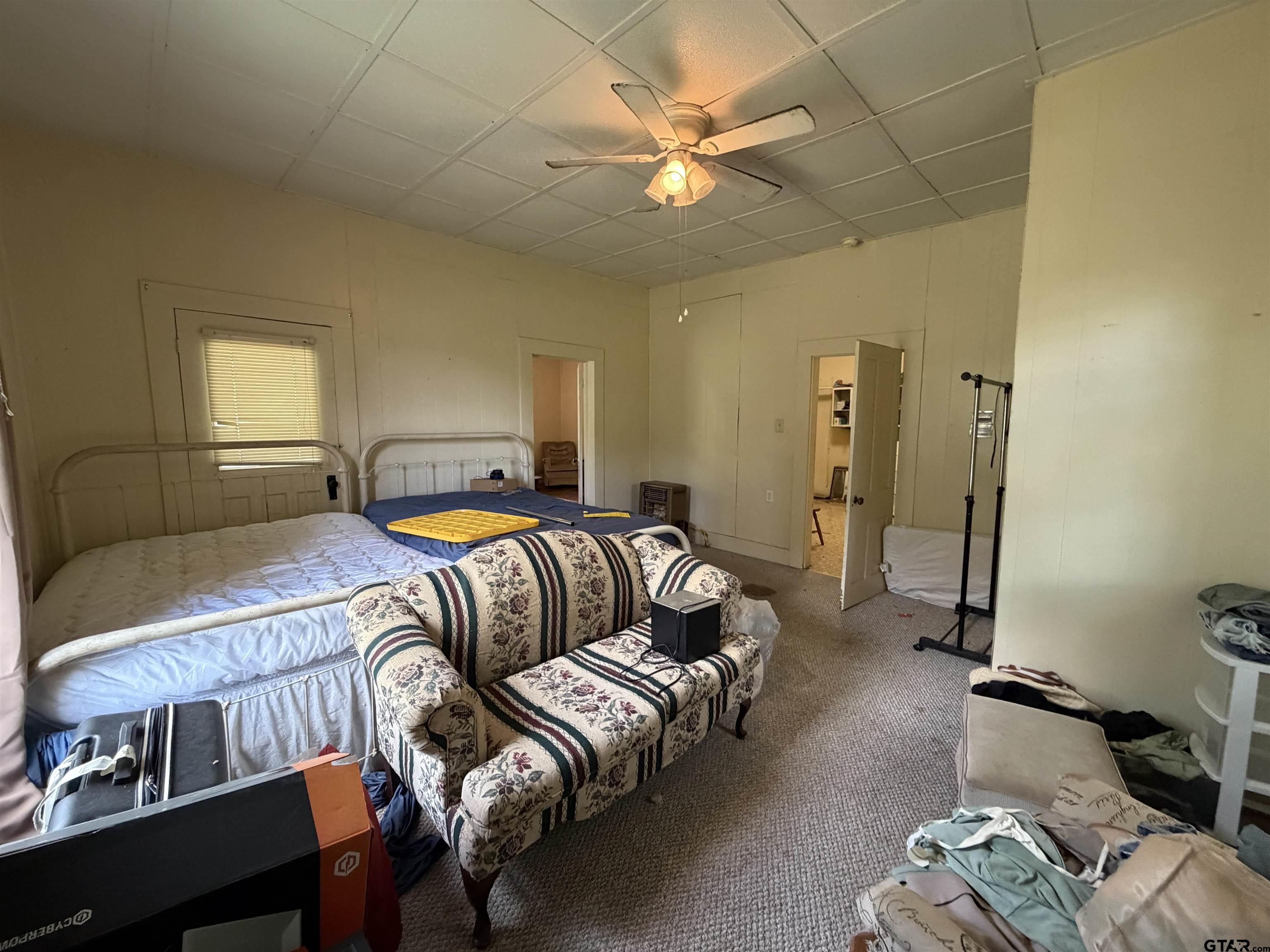 609 Walnut Mineola, TX 75773 - Photo 7 of 23 a bedroom with a bed and window