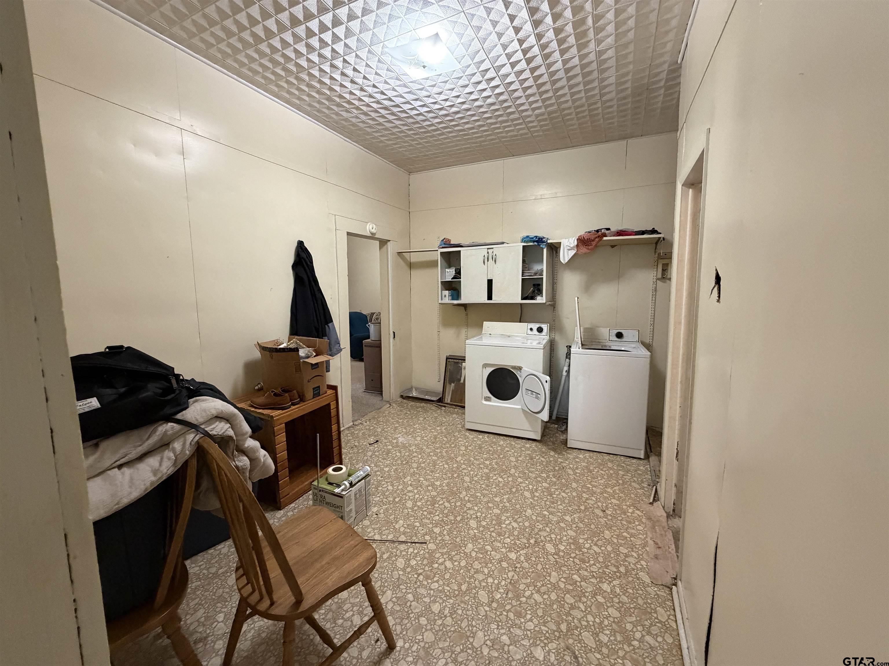 609 Walnut Mineola, TX 75773 - Photo 8 of 23 a storage room with washer and dryer