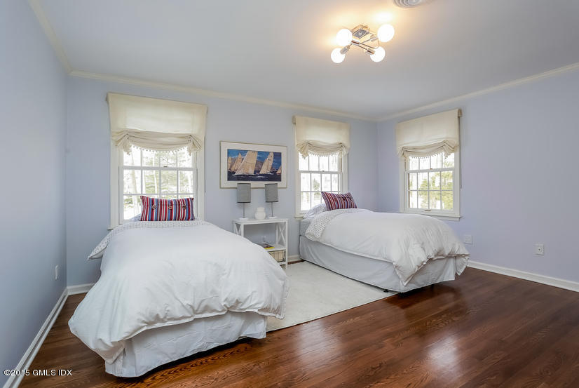 33 Normandy Lane Riverside, CT 06878 - Photo 11 of 19 a bedroom with a bed and window