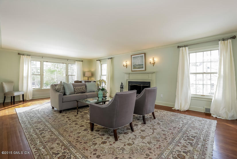 33 Normandy Lane Riverside, CT 06878 - Photo 3 of 19 a living room with furniture and a fireplace