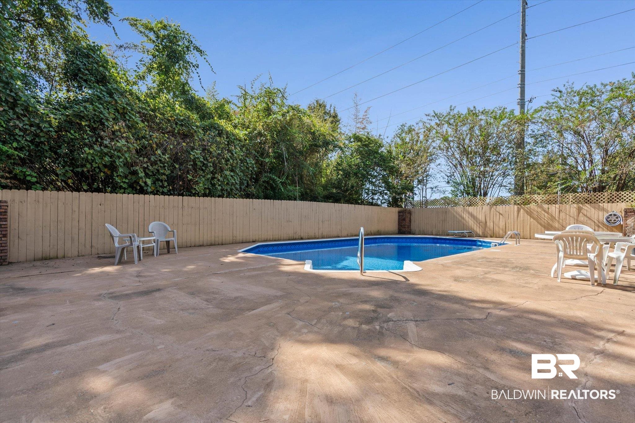 1900 Foxfire Road Mobile, AL 36618 - Photo 27 of 36 View of swimming pool featuring a patio area and a fenced backyard