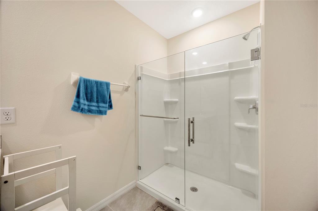 5674 Banbury Ridge Run Wesley Chapel, FL 33545 - Photo 25 of 40 a bathroom with a shower