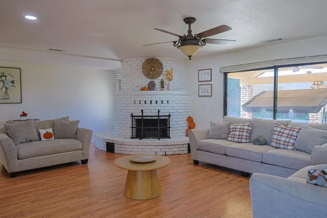 a living room with furniture and a large window