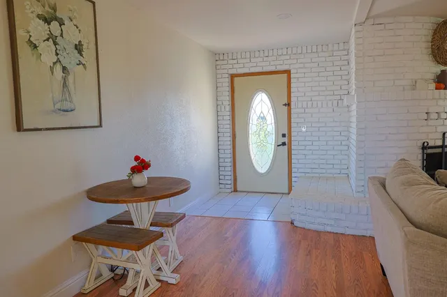 a view of a livingroom with furniture and wooden floor