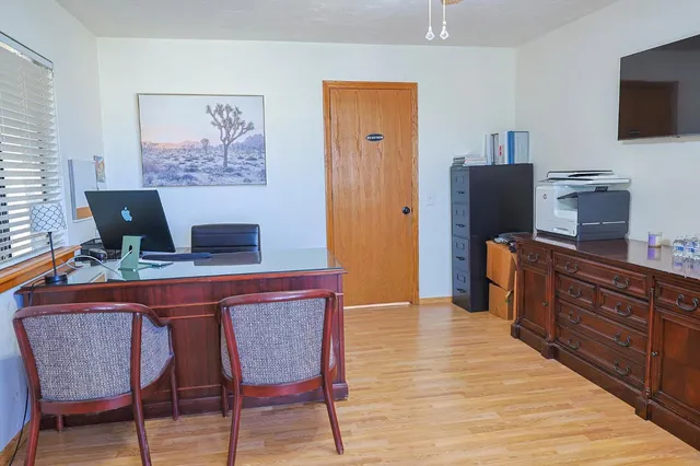 a dining room with furniture and window