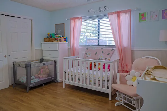a bedroom with furniture and a window