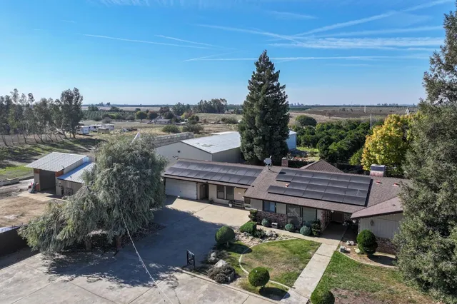 a view of a house with a garden