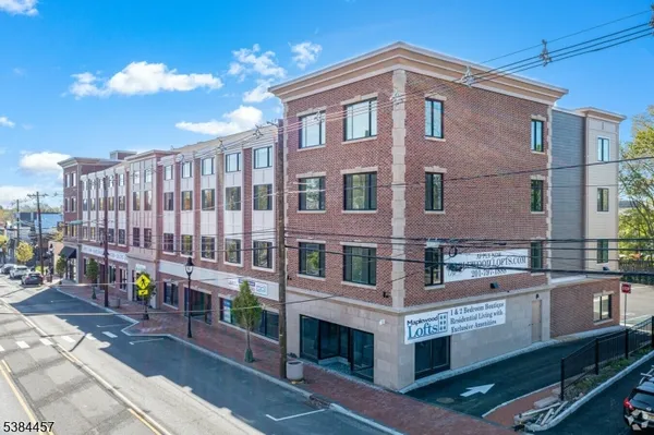 a front view of a building with balcony