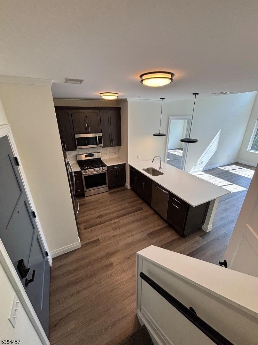 1585 Springfield Avenue, Unit 216 Maplewood, NJ 07040 - Photo 15 of 20 a living room with furniture and a table