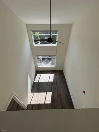 an empty room with a empty space and windows