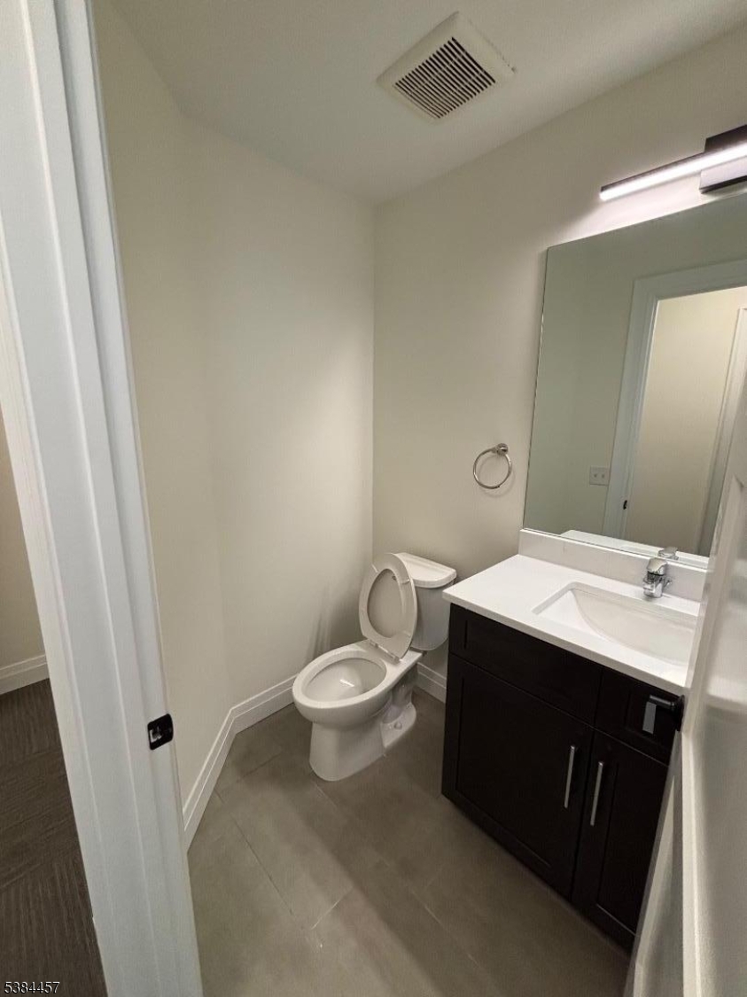 1585 Springfield Avenue, Unit 216 Maplewood, NJ 07040 - Photo 19 of 20 a bathroom with a sink and a mirror