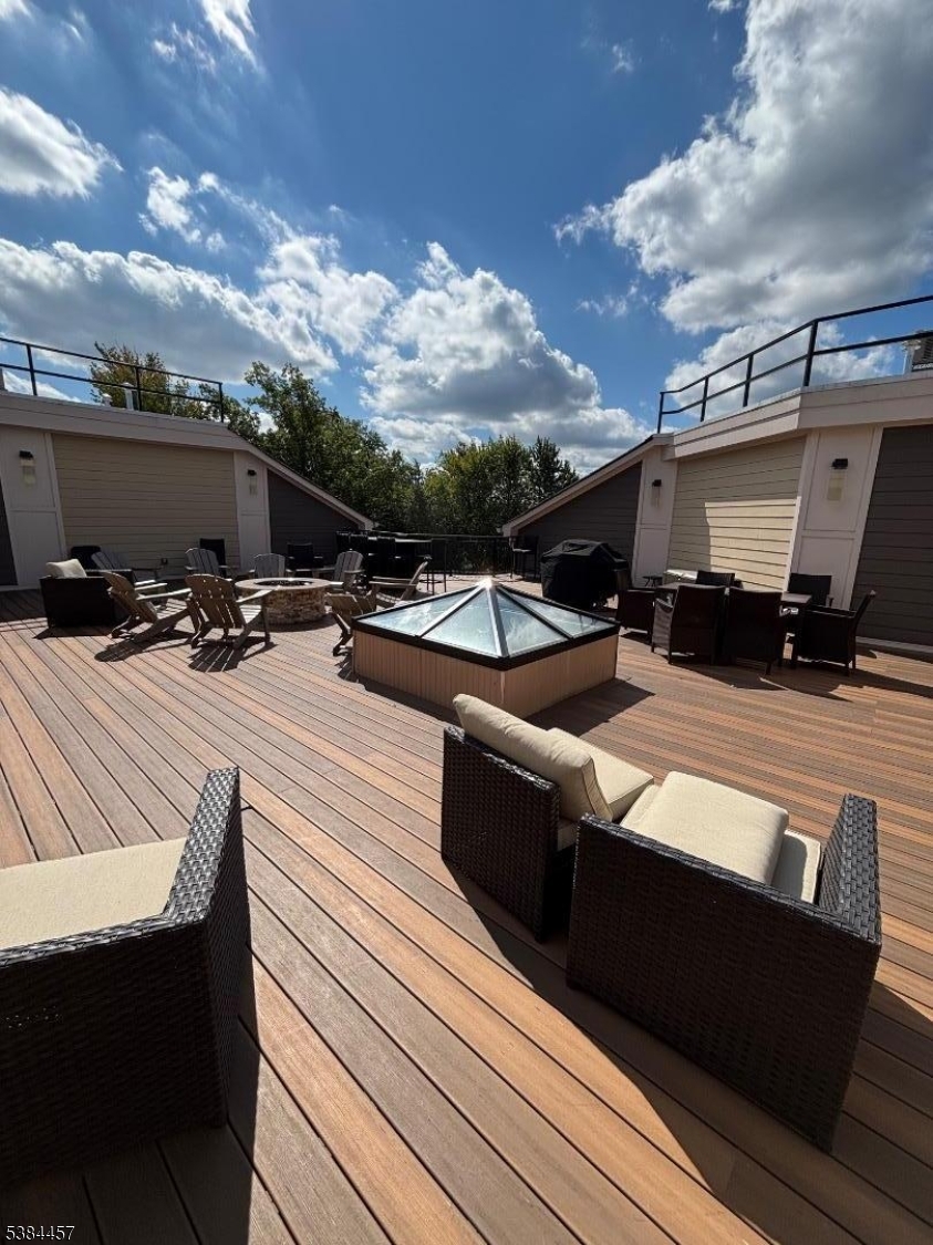 1585 Springfield Avenue, Unit 216 Maplewood, NJ 07040 - Photo 3 of 20 a view of a roof deck with couches and sky view