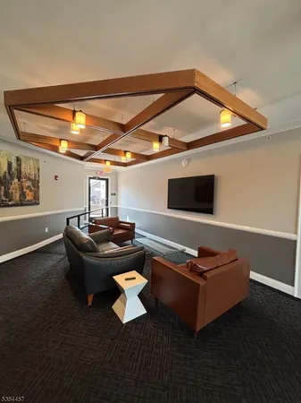 a living room with furniture and flat screen tv