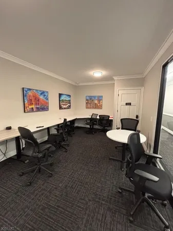 a living room with furniture a rug and a table