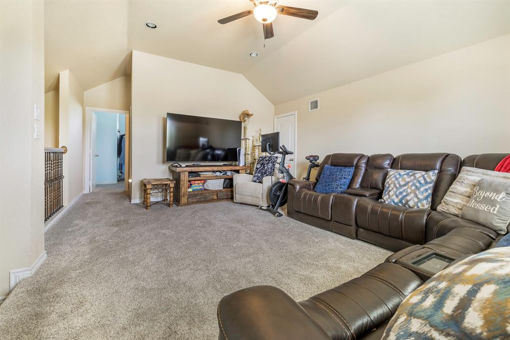 103 Brandy Lane Stephenville, TX 76401 - Photo 18 of 37 a living room with furniture and a flat screen tv