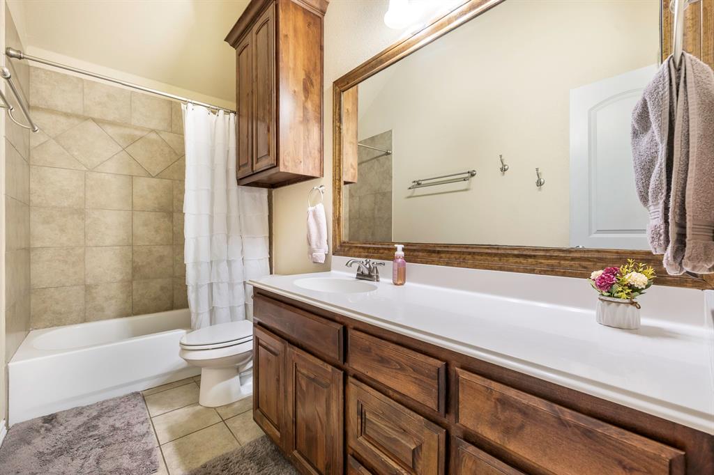 103 Brandy Lane Stephenville, TX 76401 - Photo 21 of 37 a bathroom with a sink a toilet and shower