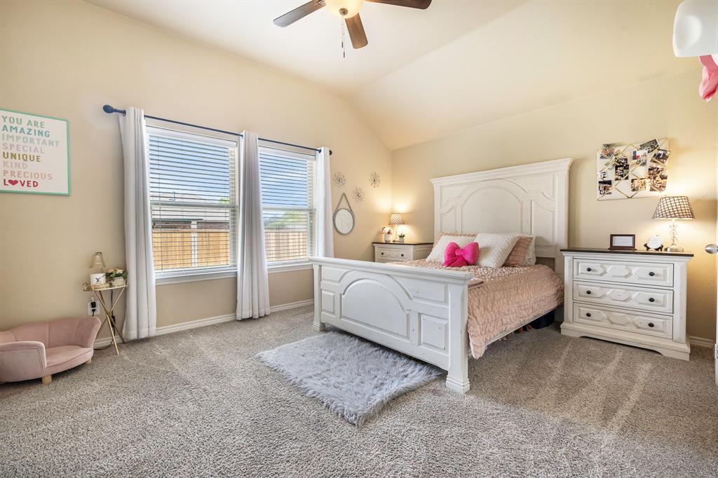 103 Brandy Lane Stephenville, TX 76401 - Photo 23 of 37 a spacious bedroom with a bed and a couch