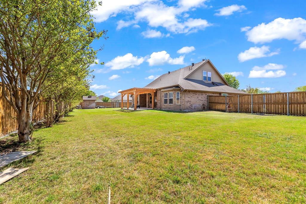103 Brandy Lane Stephenville, TX 76401 - Photo 35 of 37 a front view of a house with garden