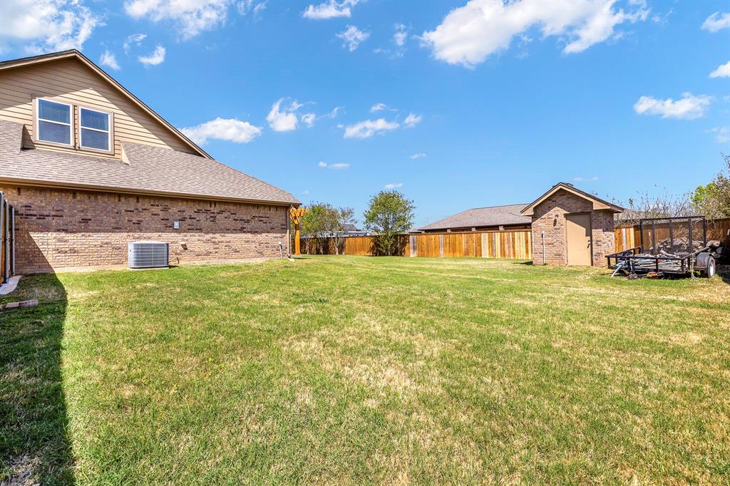 103 Brandy Lane Stephenville, TX 76401 - Photo 36 of 37 a view of a house with a yard