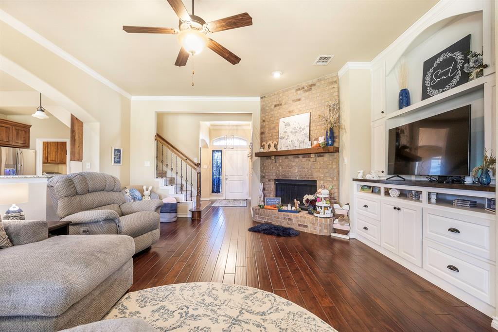 103 Brandy Lane Stephenville, TX 76401 - Photo 5 of 37 a living room with furniture fireplace and flat screen tv