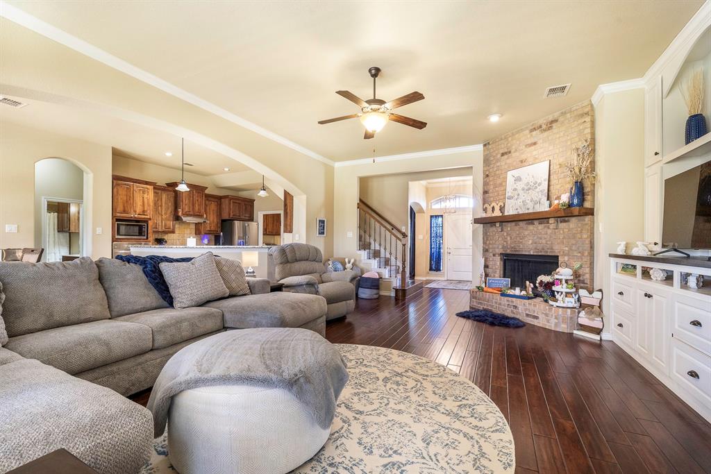 103 Brandy Lane Stephenville, TX 76401 - Photo 6 of 37 a living room with furniture and a fireplace