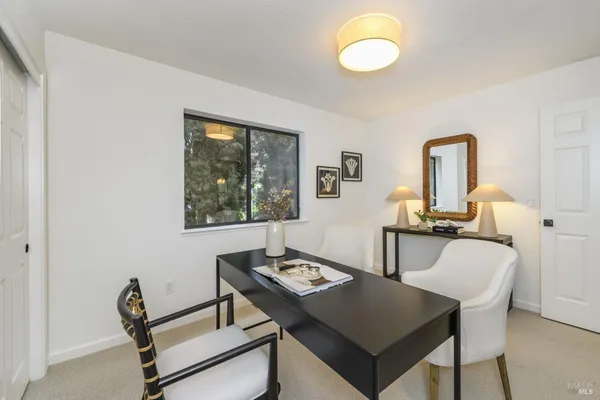 a bathroom with a shower sink vanity mirror and toilet
