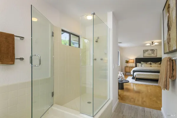 a bedroom with a large bed and a window
