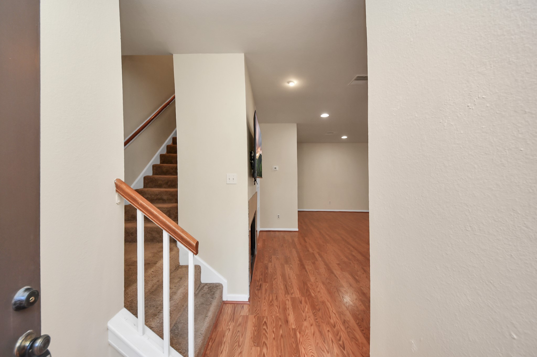 7447 Cambridge Street, Unit 106 Houston, TX 77054 - Photo 17 of 40 a view of entryway with wooden floor