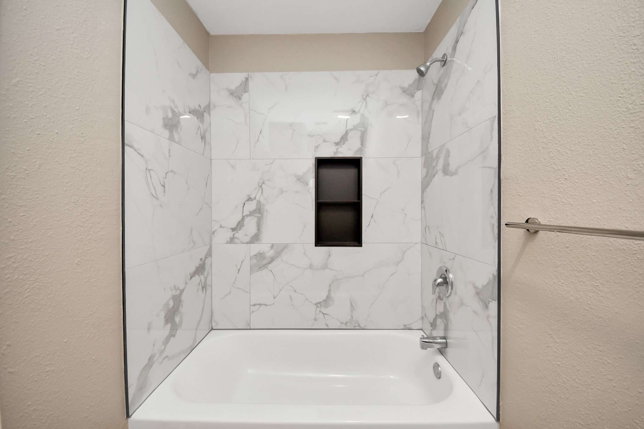 7447 Cambridge Street, Unit 106 Houston, TX 77054 - Photo 29 of 40 a bathroom with a bathtub and a shower