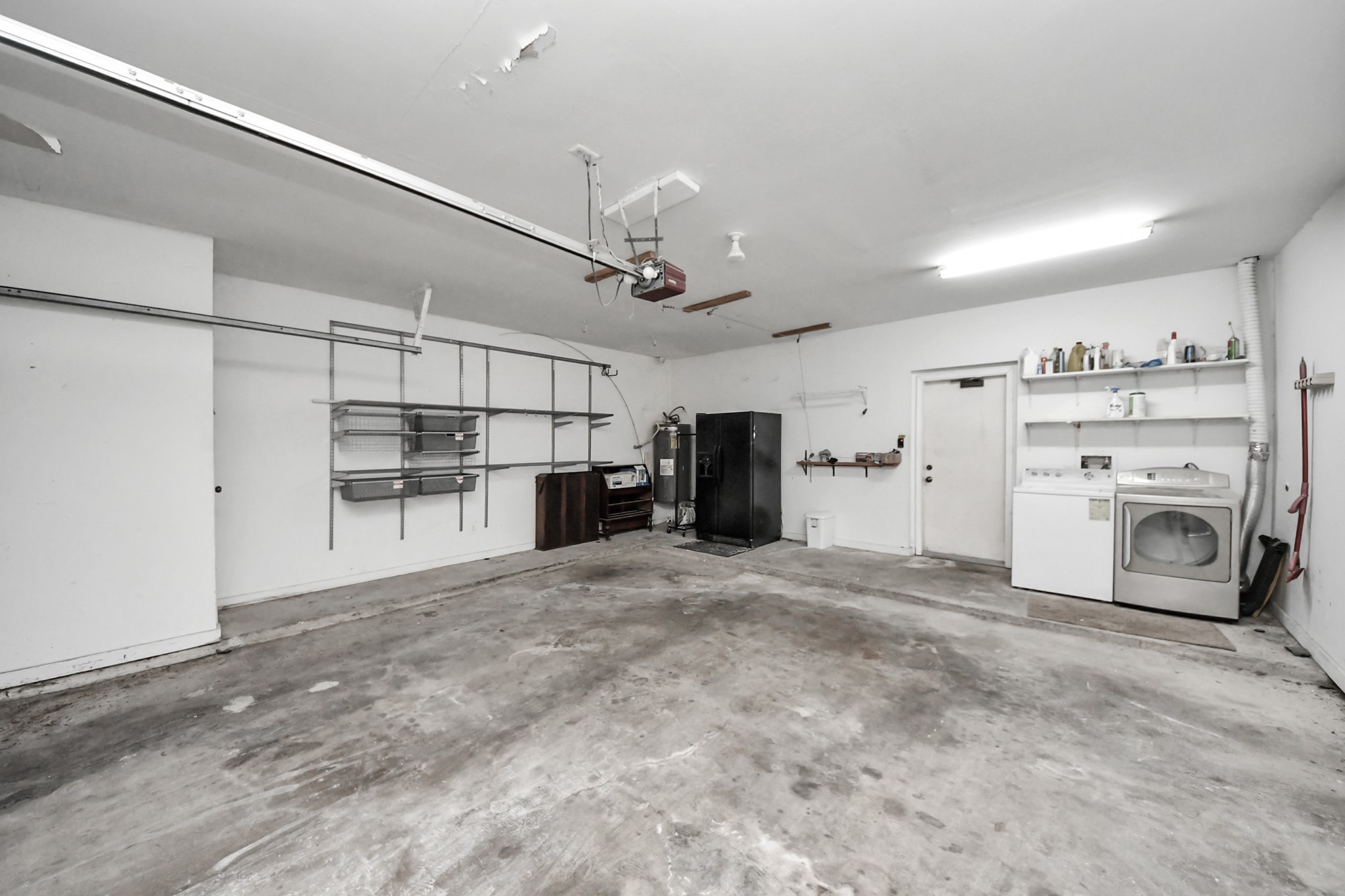 7447 Cambridge Street, Unit 106 Houston, TX 77054 - Photo 39 of 40 a view of a storage & utility room with washer and dryer