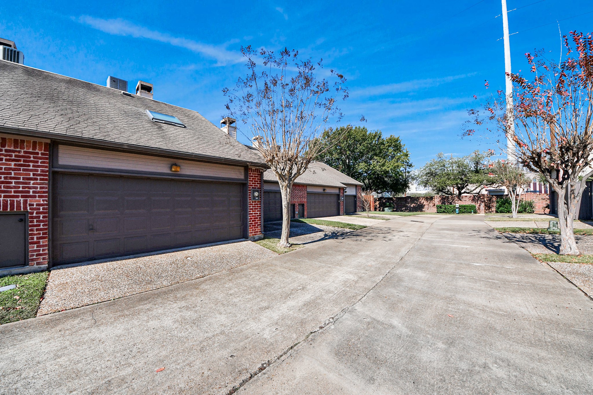 7447 Cambridge Street, Unit 106 Houston, TX 77054 - Photo 40 of 40 a front view of a house with a yard