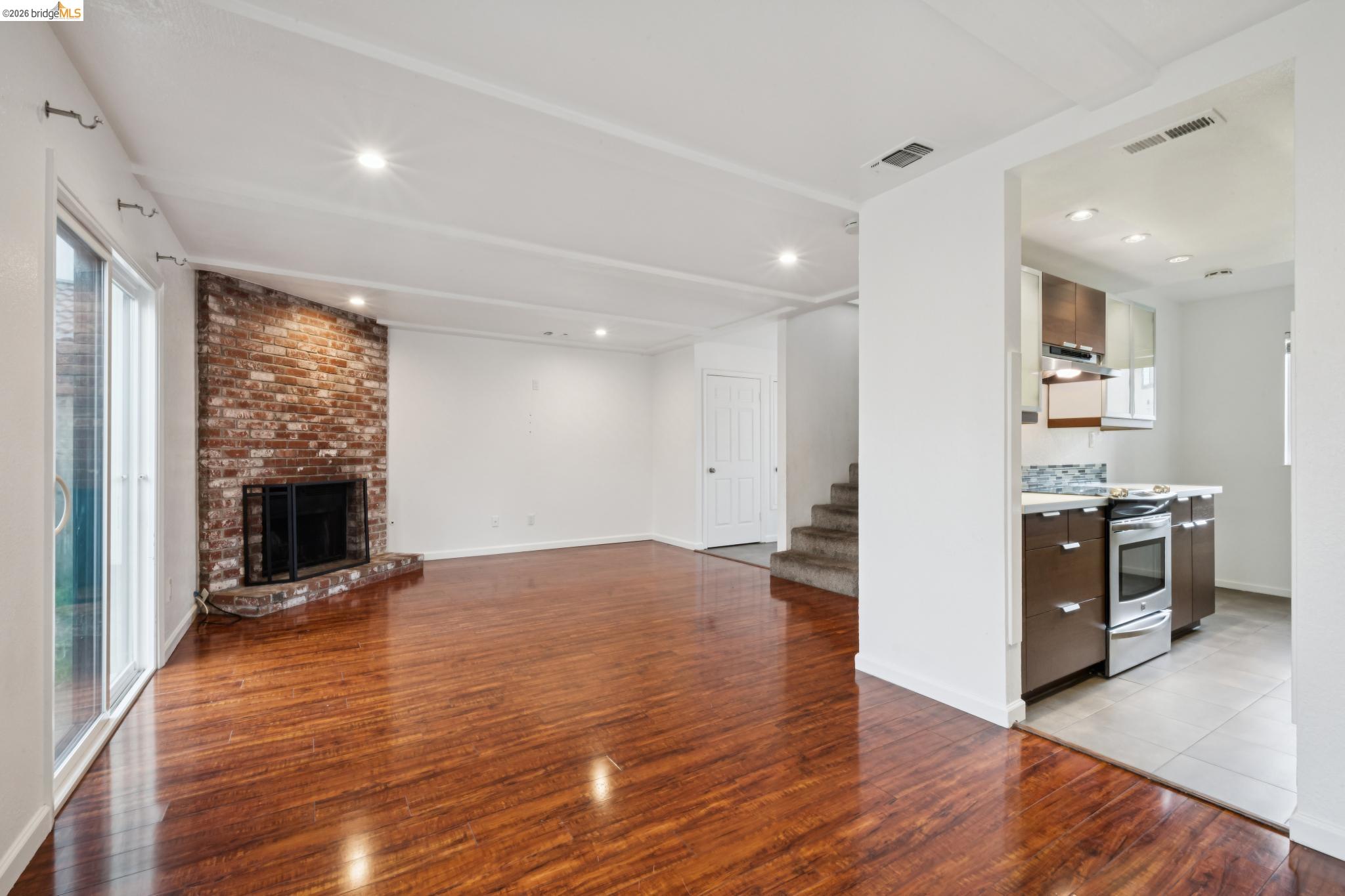2600 Giant Road, Unit 35 San Pablo, CA 94806 - Photo 5 of 15 a view of a kitchen with a stove cabinets and wooden floor