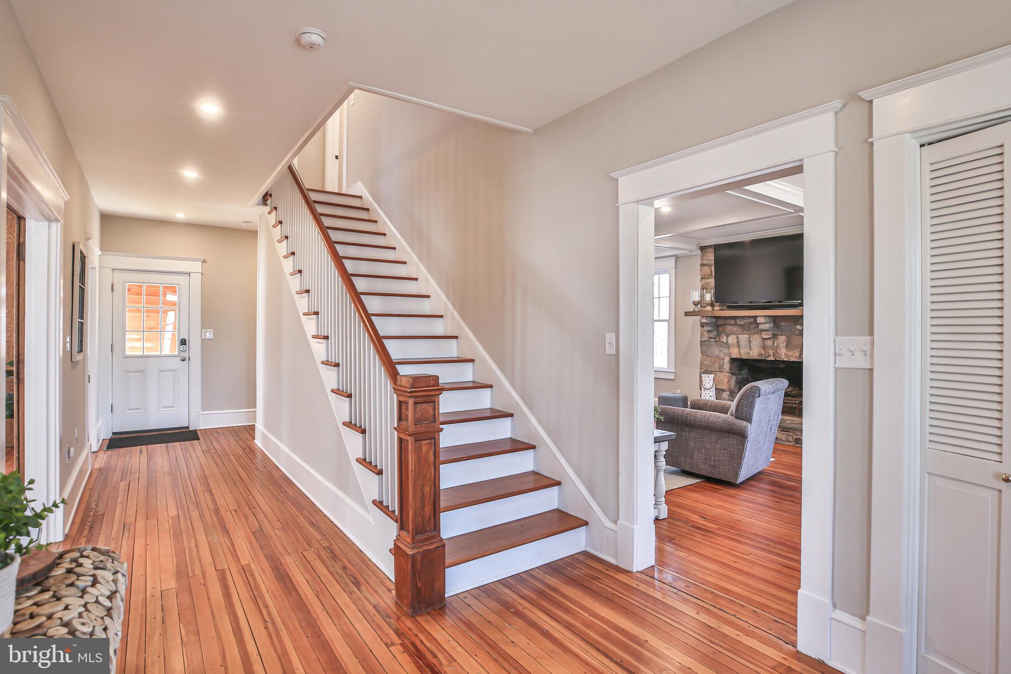 17345 Raven Rocks Road Bluemont, VA 20135 - Photo 43 of 99 a view of a hallway with wooden floor and staircase