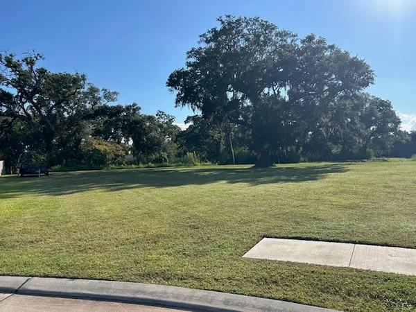 a view of a swimming pool with a yard